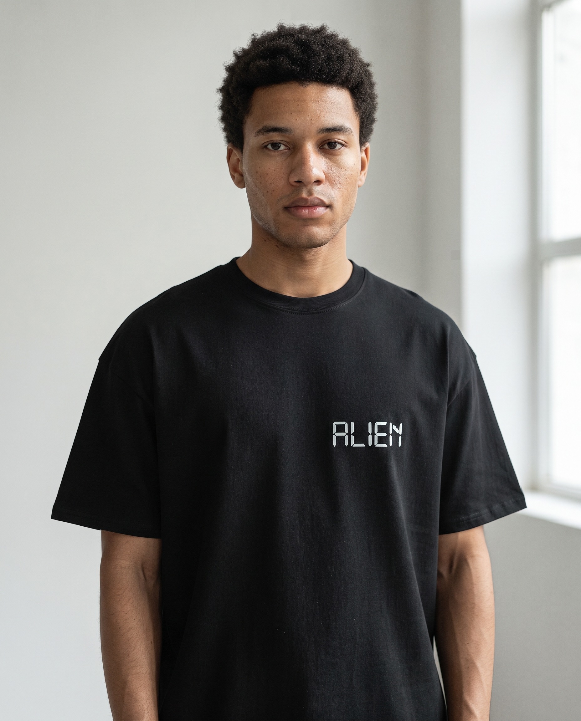 ALIEN T-Shirt by SUPERWAPA, black oversized tee worn by a model