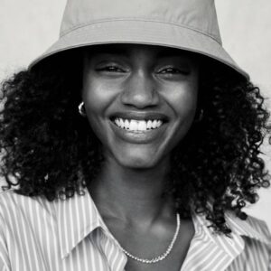 AMORE Organic Bucket Hat by SUPERWAPA, stone bucket hat worn by a model