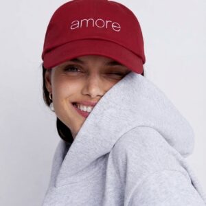 AMORE cranberry dad cap by SUPERWAPA worn by a model