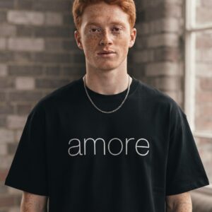 AMORE T-Shirt by SUPERWAPA, black oversized tee worn by a model