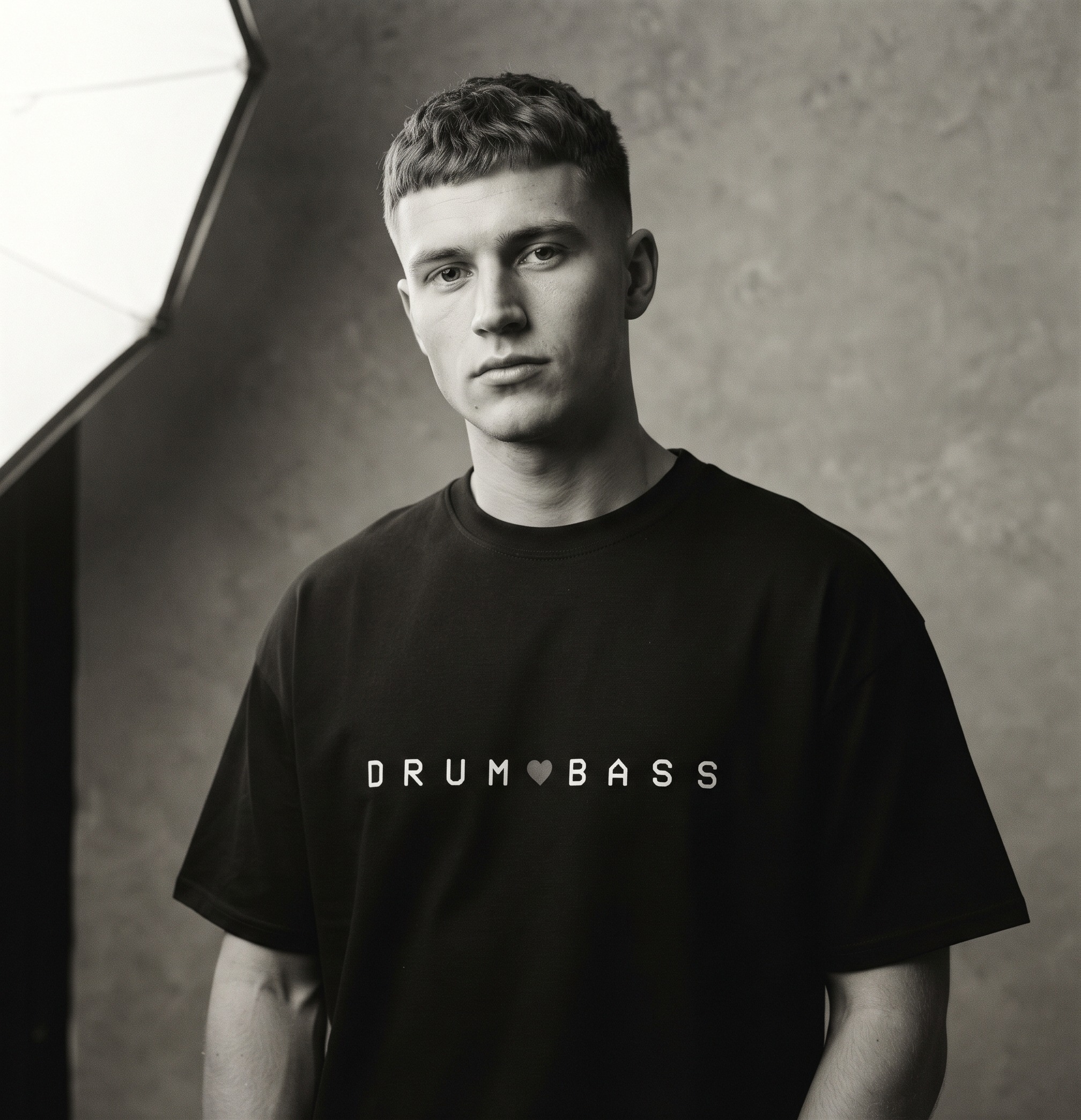 Drum & Bass T-Shirt by SUPERWAPA, black oversized tee worn by a model