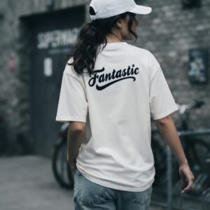FANTASTIC T-Shirt by SUPERWAPA, white oversized tee with back print worn by a model