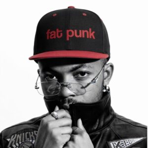 Fat Punk Cap by SUPERWAPA, black and red snapback worn by a model