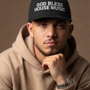 GOD BLESS HOUSE MUSIC Cap by SUPERWAPA, black snapback worn by a model