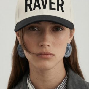 RAVER Cap Cream by SUPERWAPA, cream and black snapback worn by a model